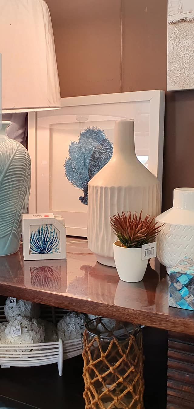 A Table With a Vase and a Picture on It — Atherton Decor Centre In Atherton, QLD