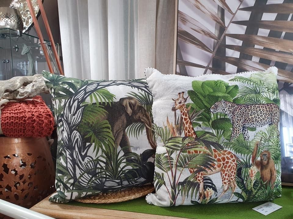Two Pillows With Animals on Them Are Sitting on a Table — Atherton Decor Centre In Atherton, QLD