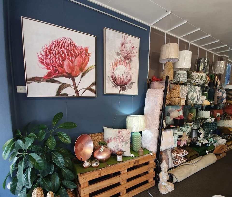 A Living Room Filled With Furniture and Paintings on the Wall — Atherton Decor Centre In Atherton, QLD