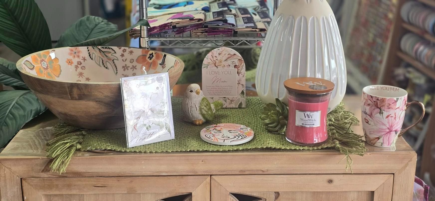 A Wooden Table Topped With a Bowl , Candle , Vase and Mugs — Atherton Decor Centre In Atherton, QLD