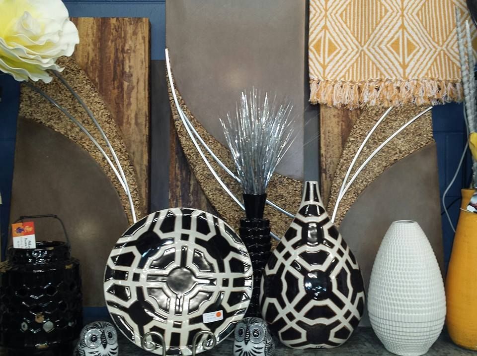 A Group of Black and White Vases Are Sitting on a Table — Atherton Decor Centre In Tablelands, QLD