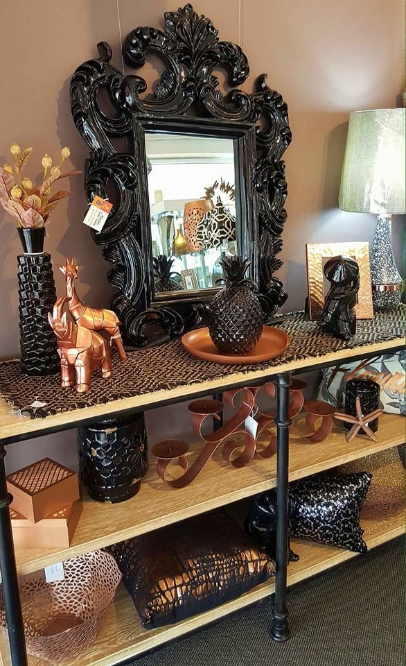 A Table With a Mirror and a Shelf With a Lot of Decorations on It — Atherton Decor Centre In Mareeba, QLD