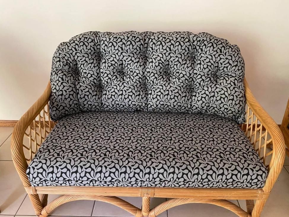 A Wicker Couch With a Black and White Patterned Cushion — Atherton Decor Centre In Atherton, QLD