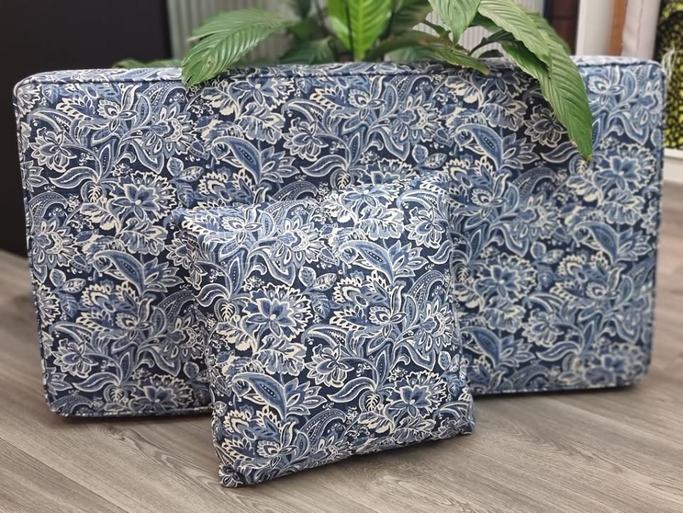 Two Pillows Are Sitting Next to Each Other on a Wooden Floor — Atherton Decor Centre In Atherton, QLD