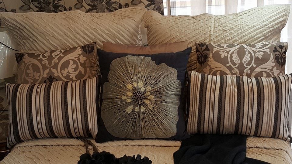 A Bed With a Lot of Pillows on It — Atherton Decor Centre In Tablelands, QLD