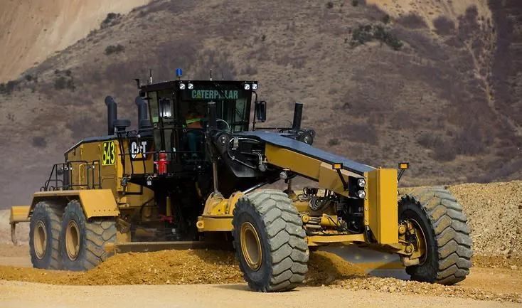 A Large Yellow Tractor is Driving Down a Dirt Road — OG Diesel NQ in Garbutt, QLD