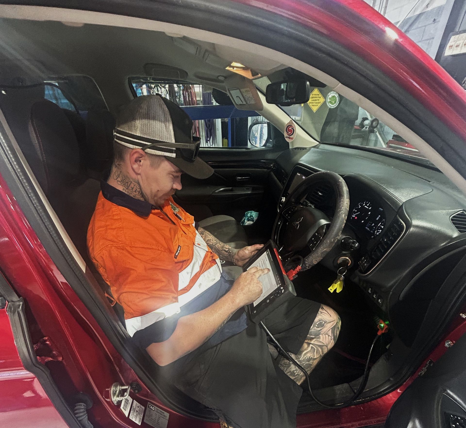 A Person is Working on a Laptop Computer In The Car— OG Diesel NQ in Garbutt, QLD