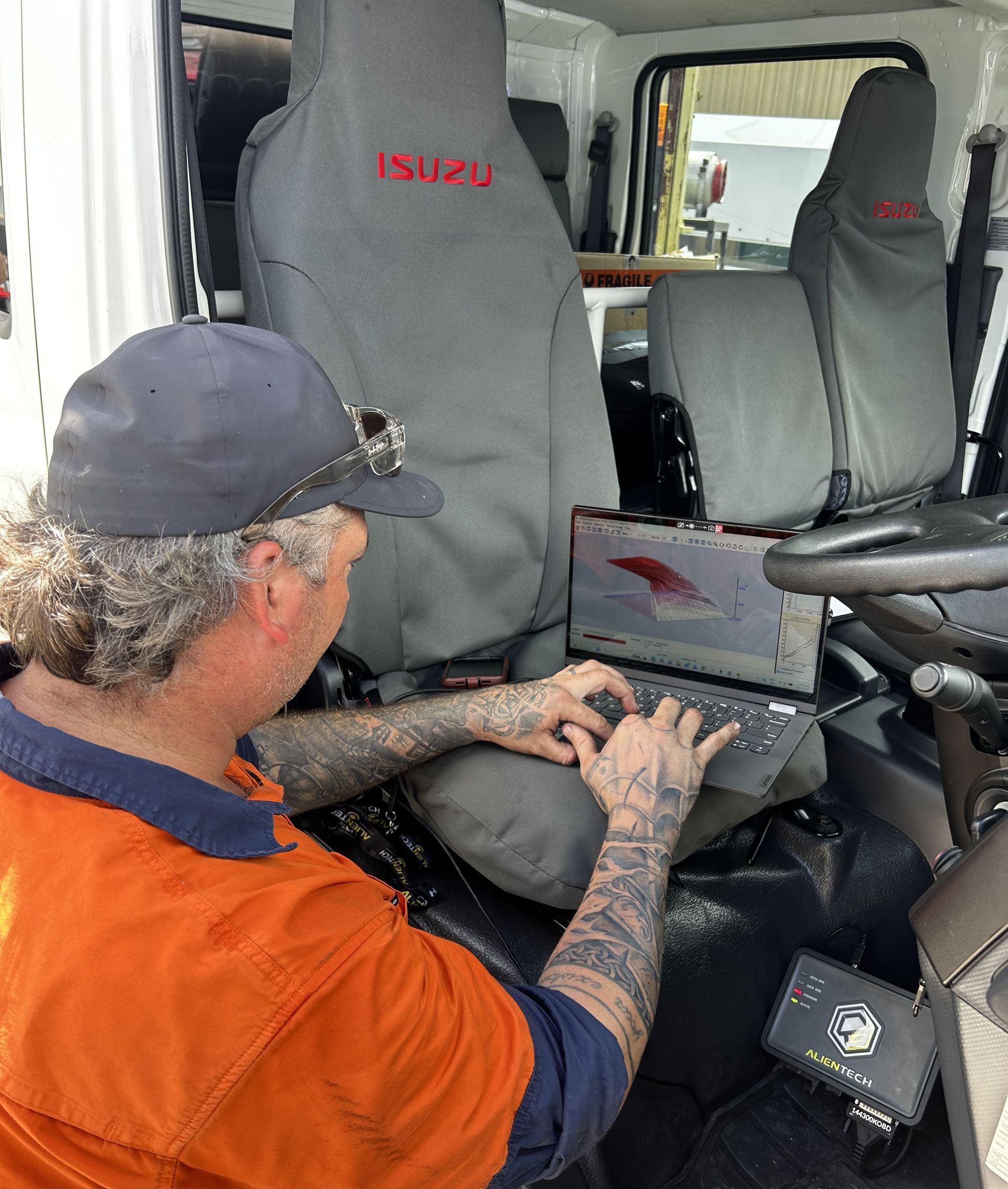 A Person is Working on a Laptop Computer In The Car— OG Diesel NQ in Garbutt, QLD
