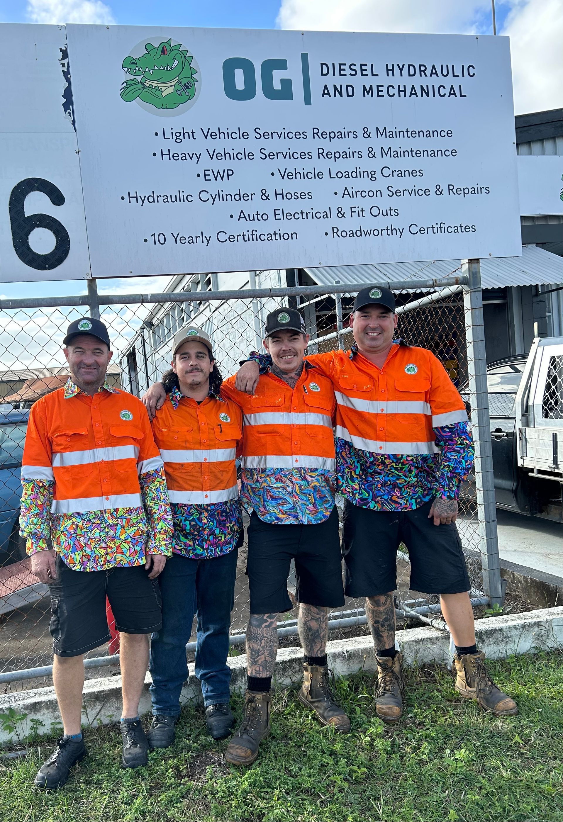 A Man is Standing Next to a Green Crane in a Parking Lot — OG Diesel NQ in Garbutt, QLD