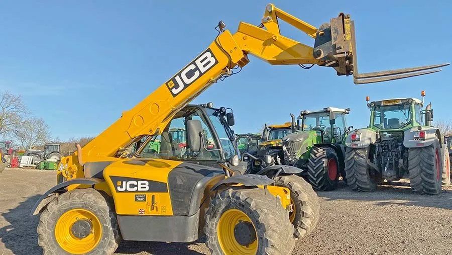A Yellow and Black JCB Telescopic Forklift is Parked Next to a Tractor — OG Diesel NQ in Garbutt, QLD
