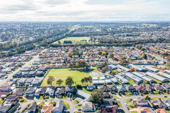 An Aerial View of a Residential Area With Lots of Houses and Trees — Bonanno's Menswear in Engadine, NSW