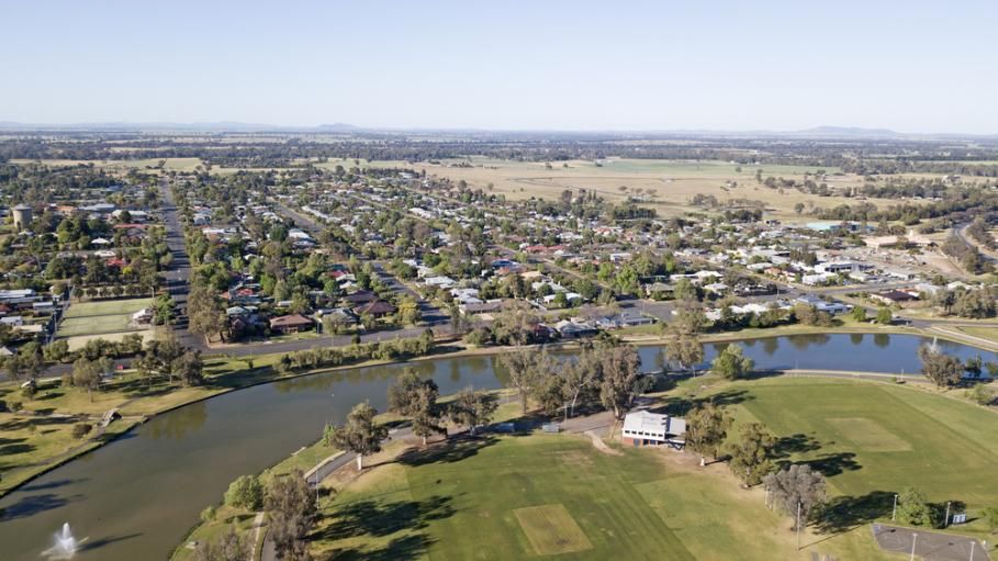 An Aerial View of a Golf Course Surrounded by Trees and a Lake — Bonanno's Menswear in Sutherland, NSW