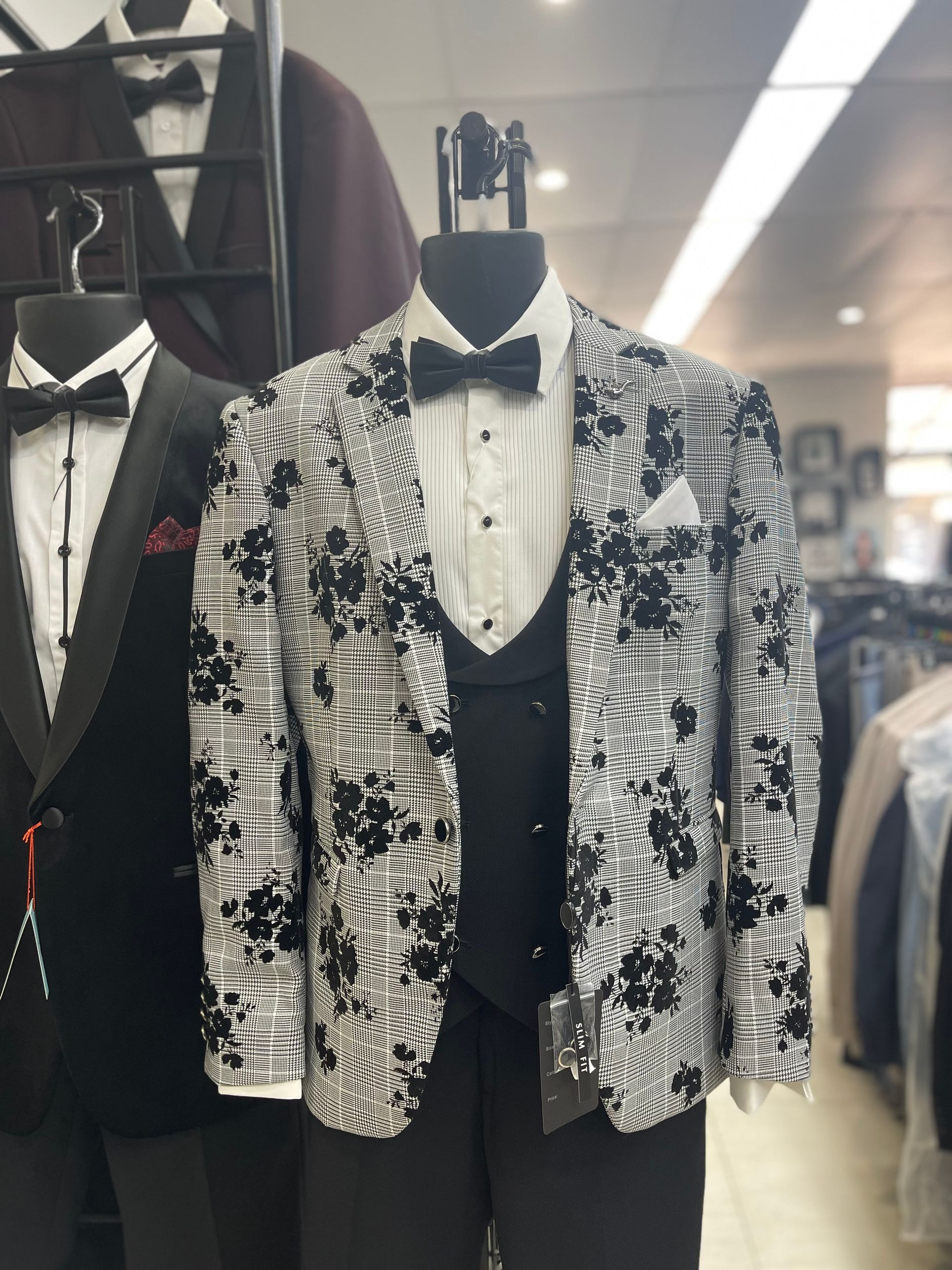 A Black and White Tuxedo Jacket is on a Mannequin in a Store — Bonanno's Menswear in Fairy Meadow, NSW