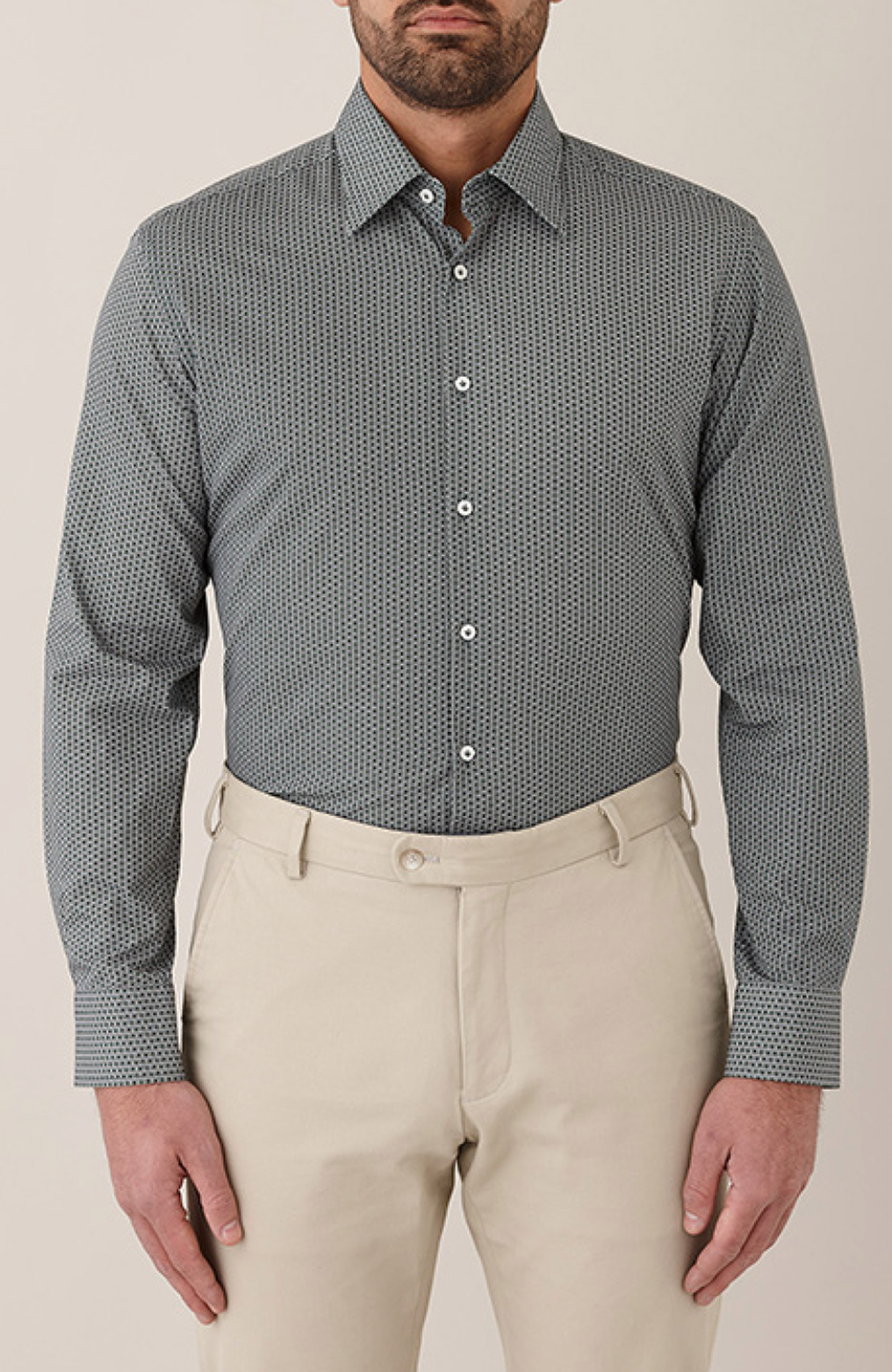 A Man With a Beard is Wearing a Striped Shirt and Khaki Pants — Bonanno's Menswear in Fairy Meadow, NSW