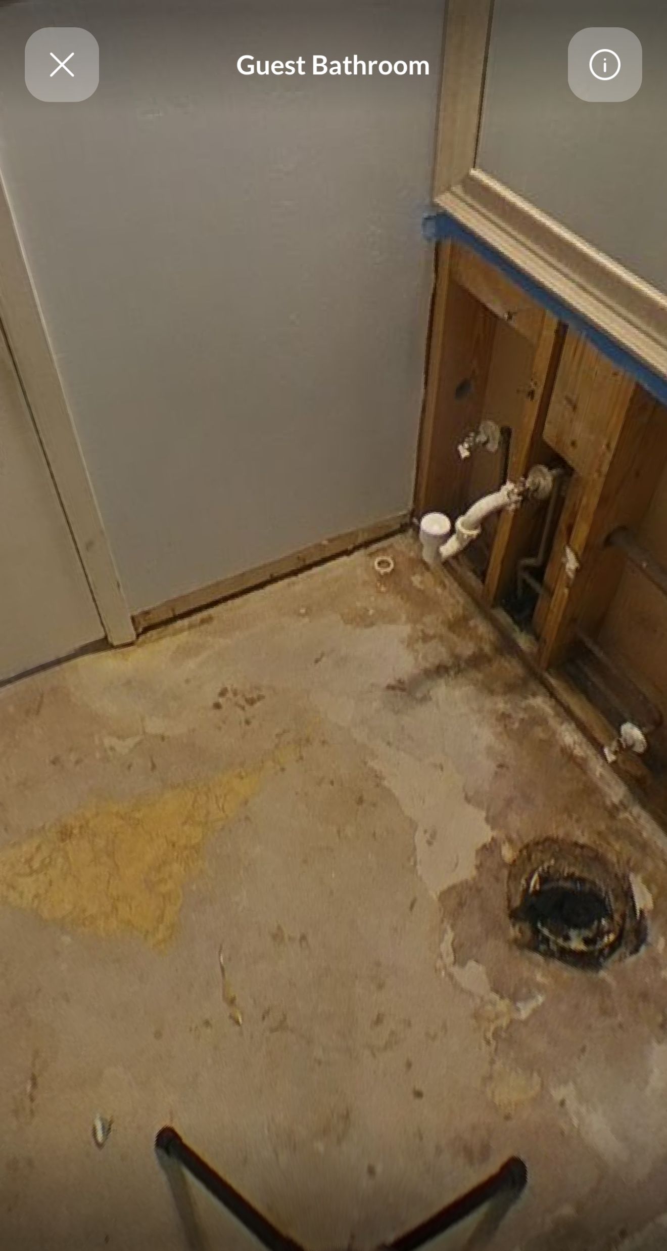 A bathroom with a sink and a toilet in it.