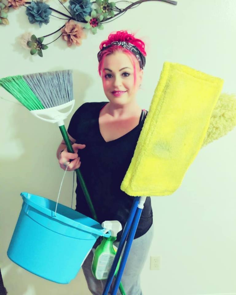 Housekeeping and Janitorial Services — Woman in Red Hair with Cleaning Materials in Crestview, FL