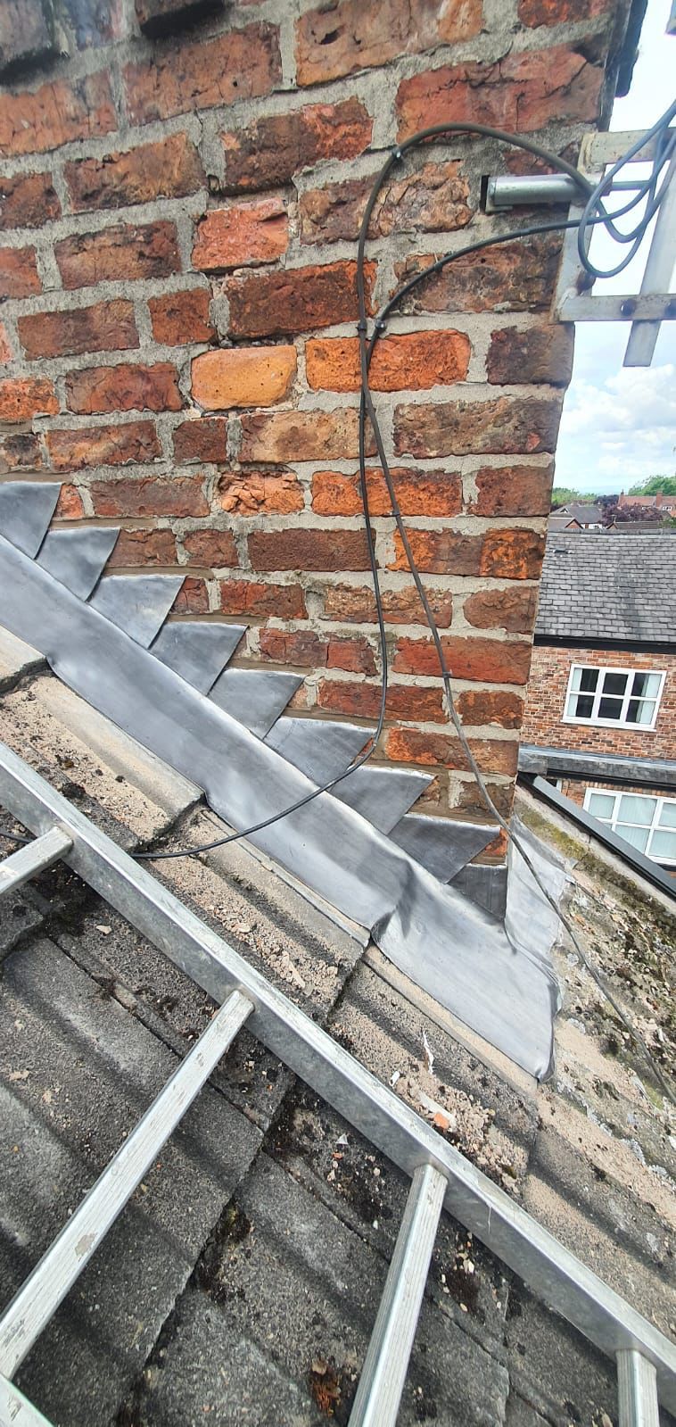A picture of chimney flashing repair carried out by roofers Manchester