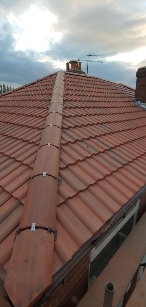 A picture of a new hipped roof installed by roofers Manchester