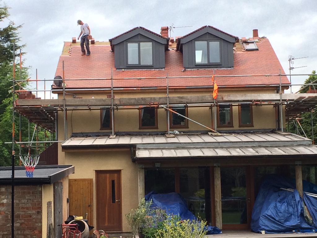 A picture of a new dormer roof being installed by Roofers Manchester