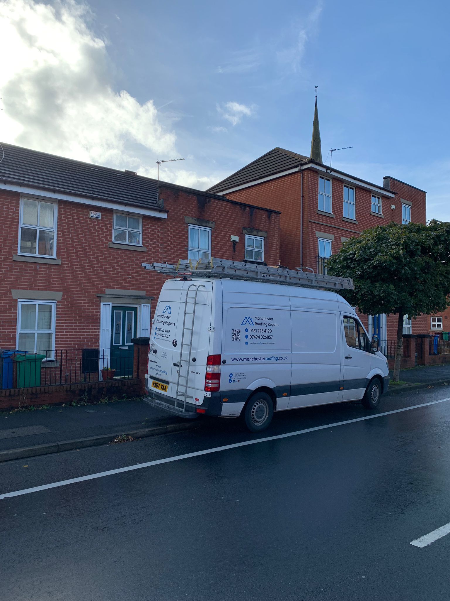 a picture of the Manchester roofing van outside a property
