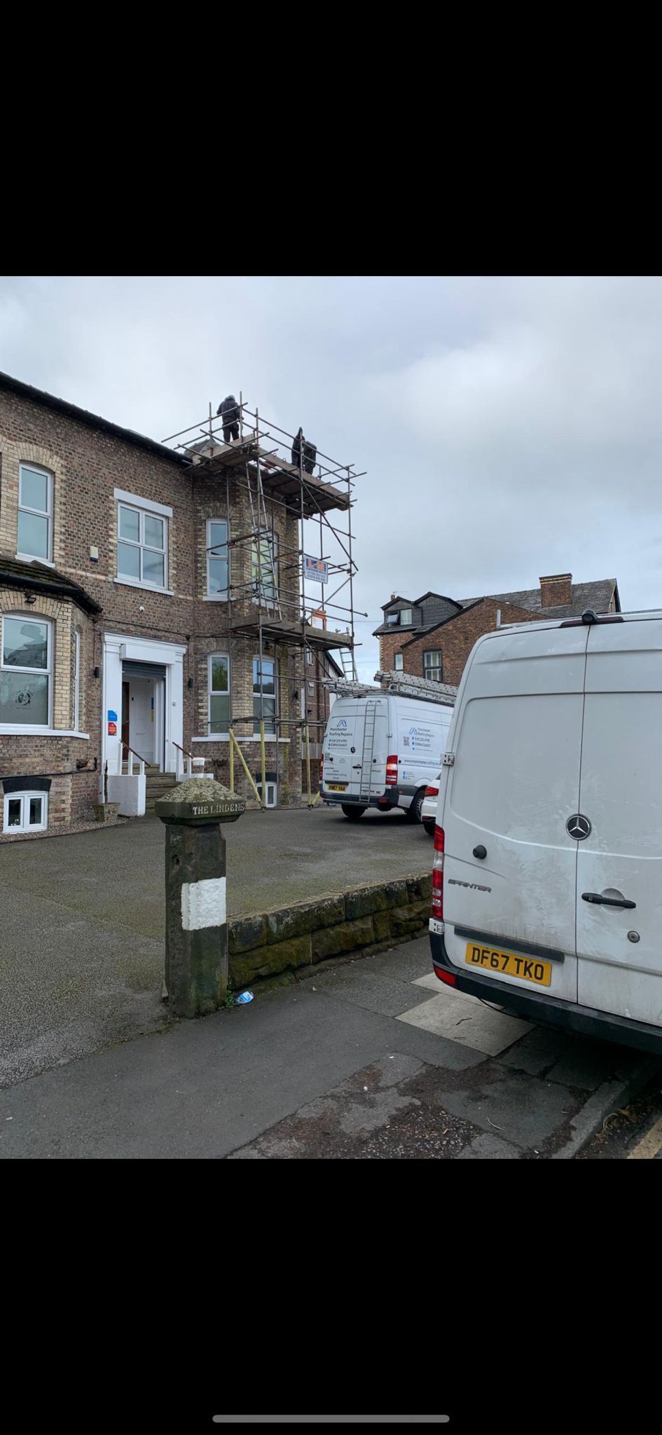 A picture of the Manchester Roofing Repairs Team carrying out  a Slate Roof Repair