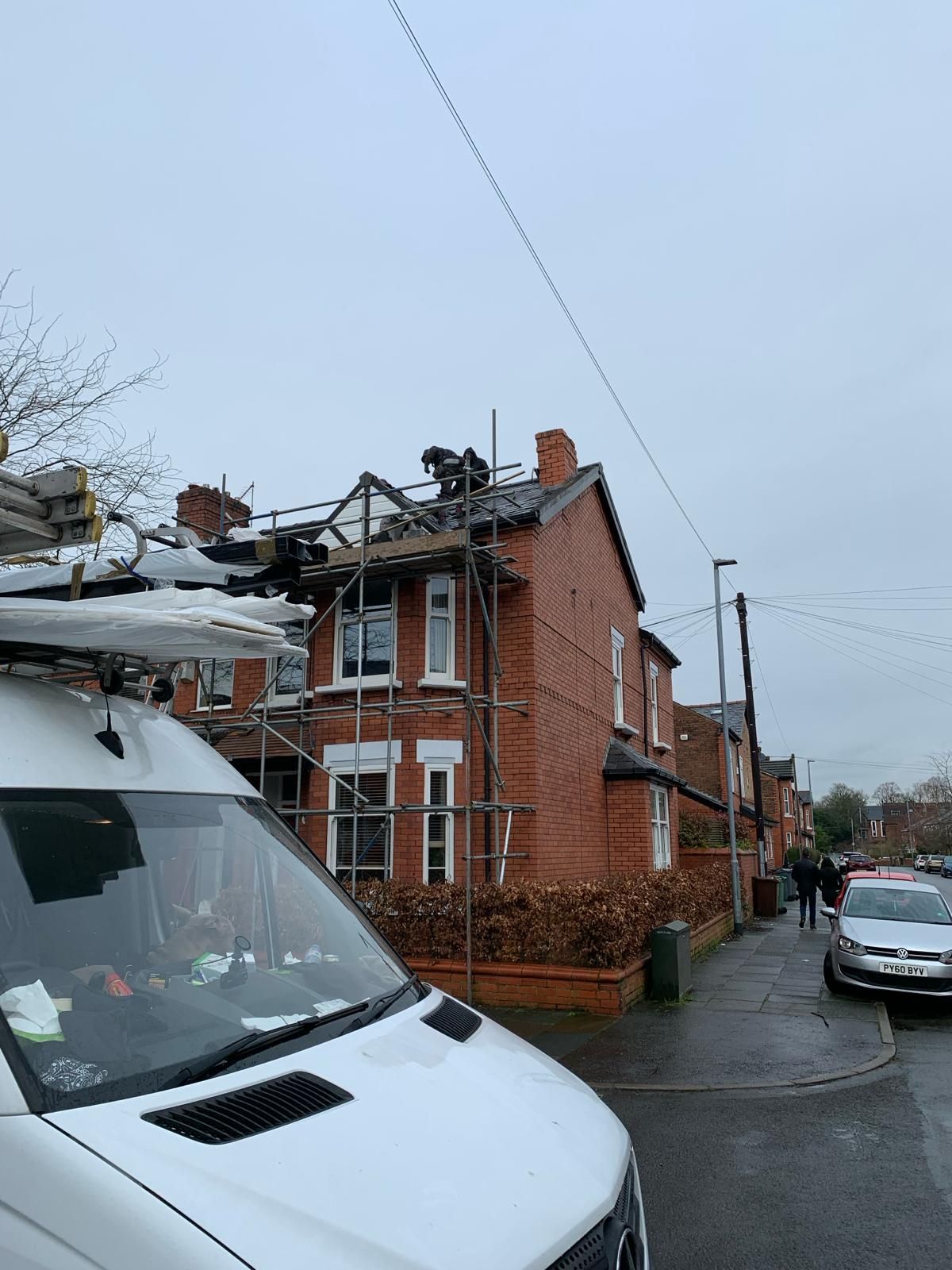 A picture of Manchester Roofing Repairs carrying out roof repairs on an end terrace property