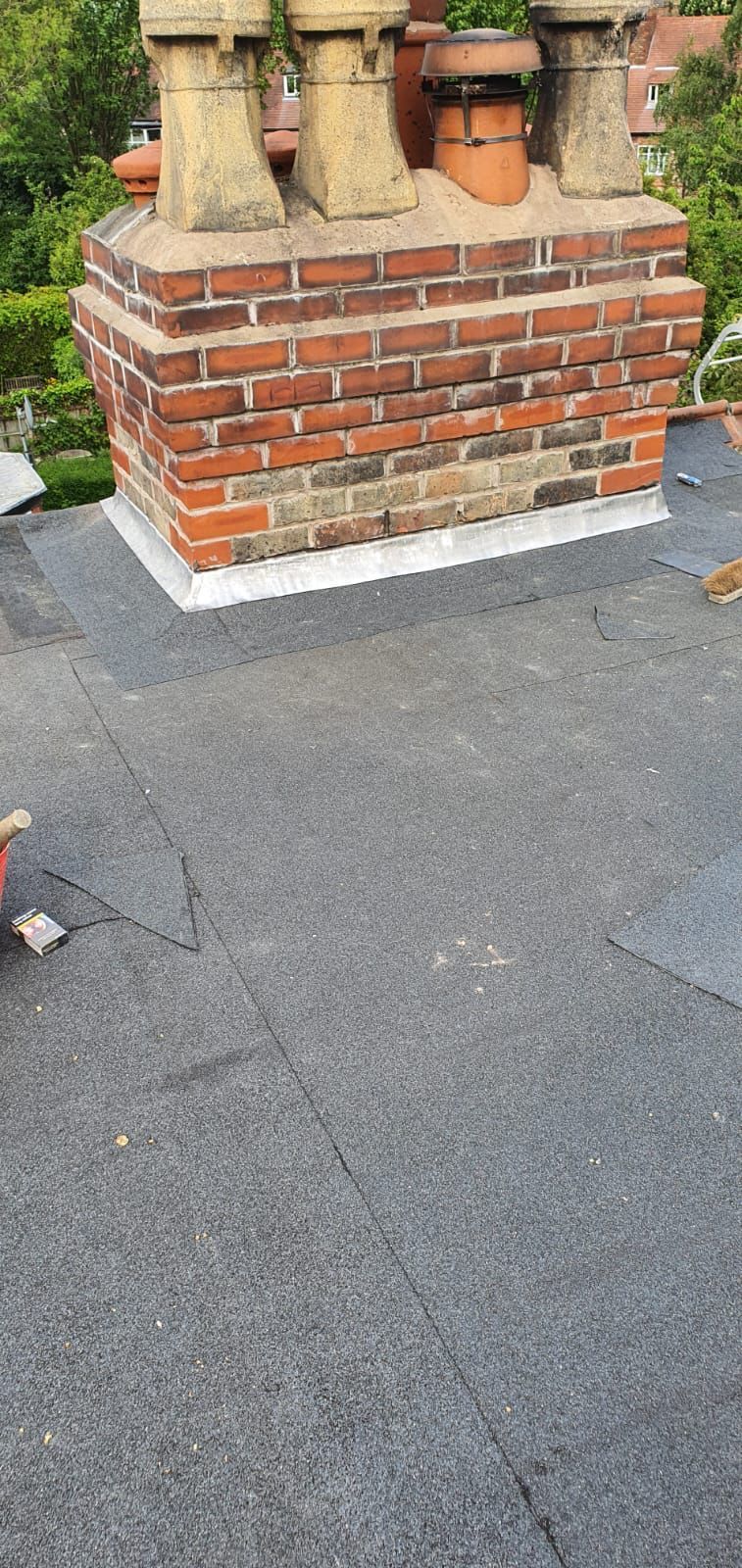 A picture of chimney flashing repair carried out by Roofers Manchester