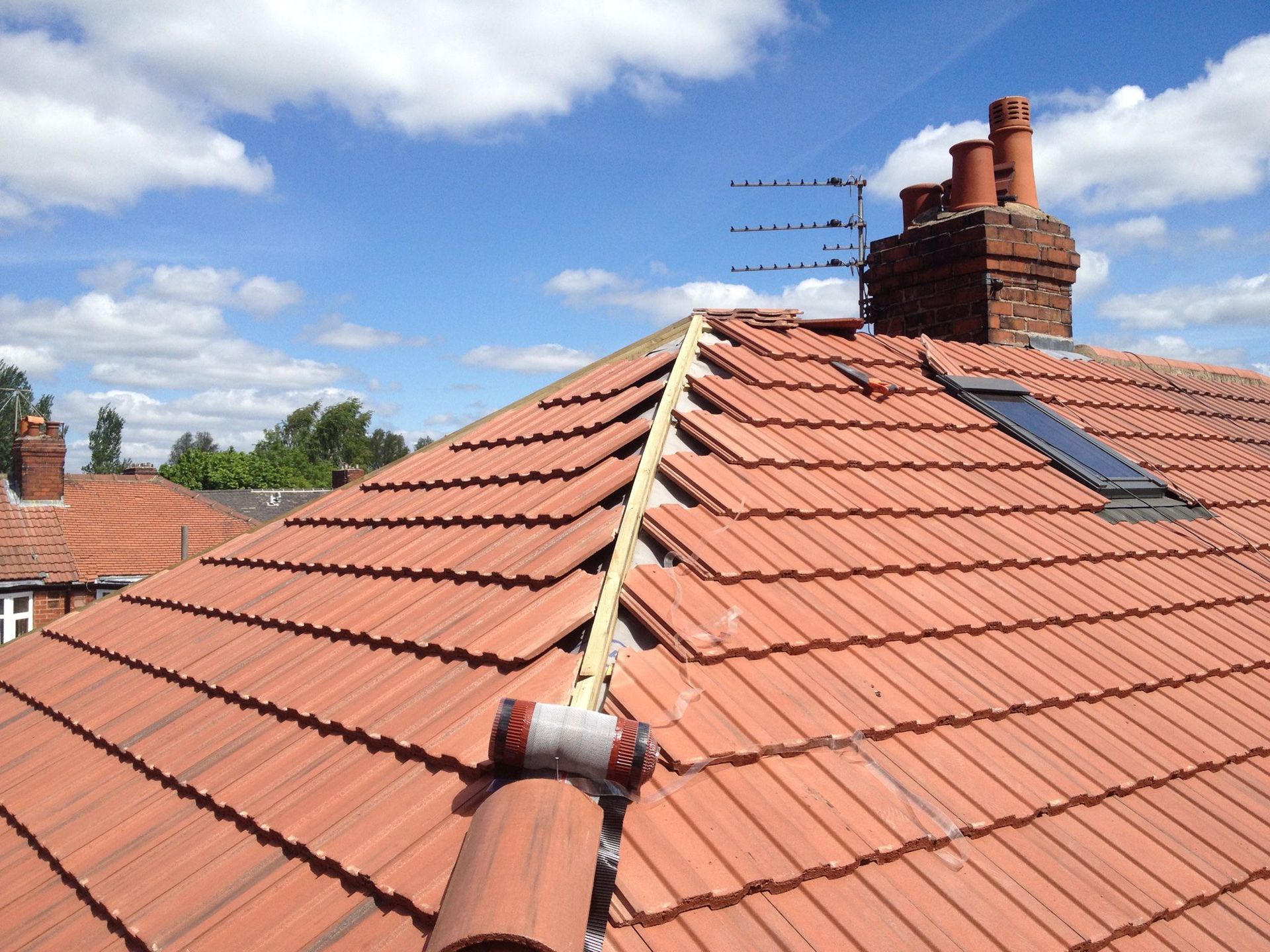 A picture of a hipped pitch replaced by Roofers Manchester