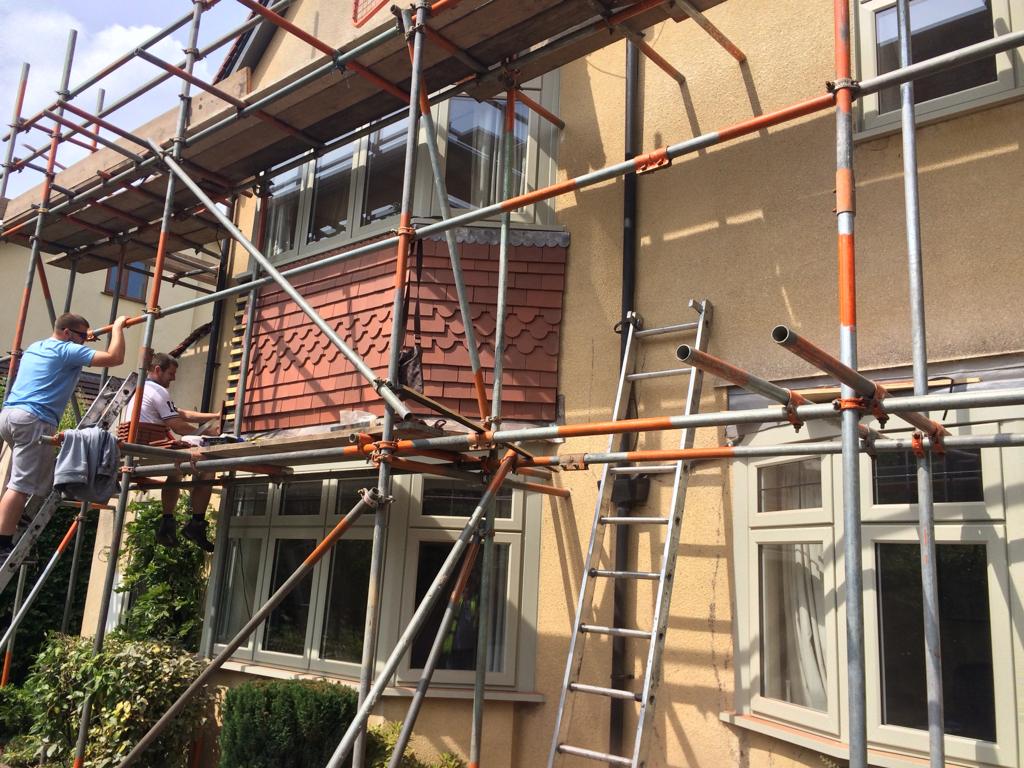 Picture of scaffolding outside a property about to be replaced by Roofers Manchester