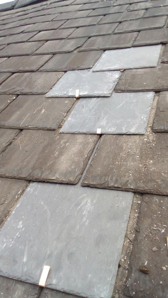A picture of slate tile repairs carried out by Roofers Manchester