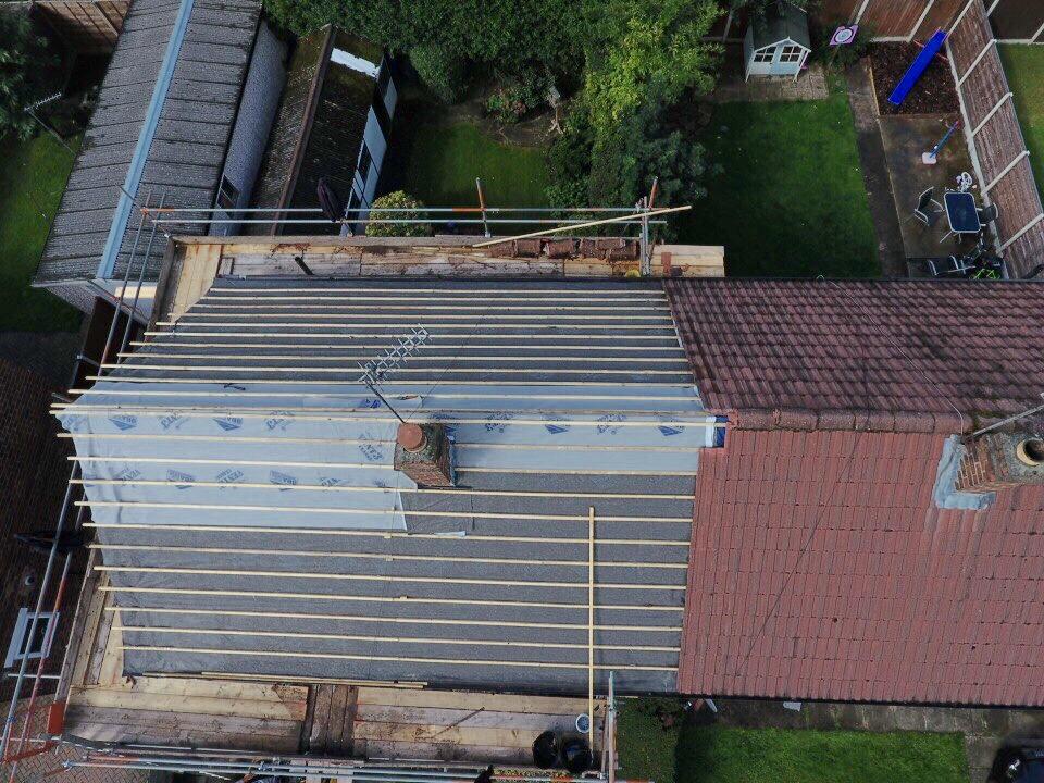 Aerial view of a roof that has new felt and laths carried out by roofers  Manchester