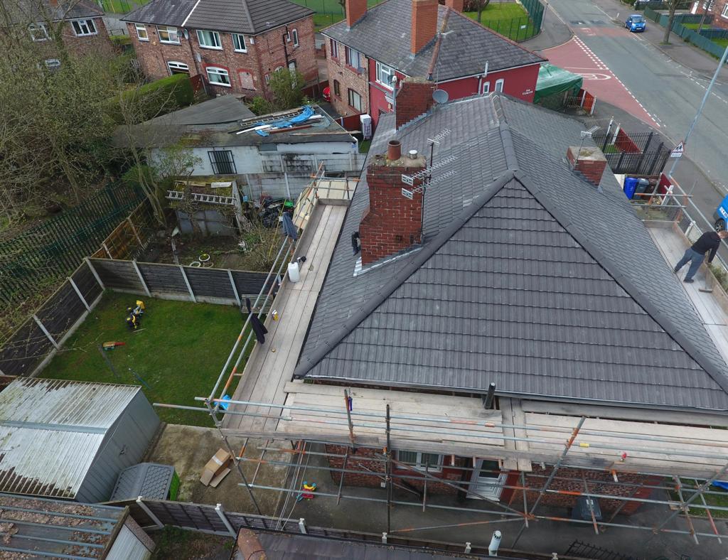 A picture of a scaffolding outside a property that is ready to be re-roofed by Roofers Manchester