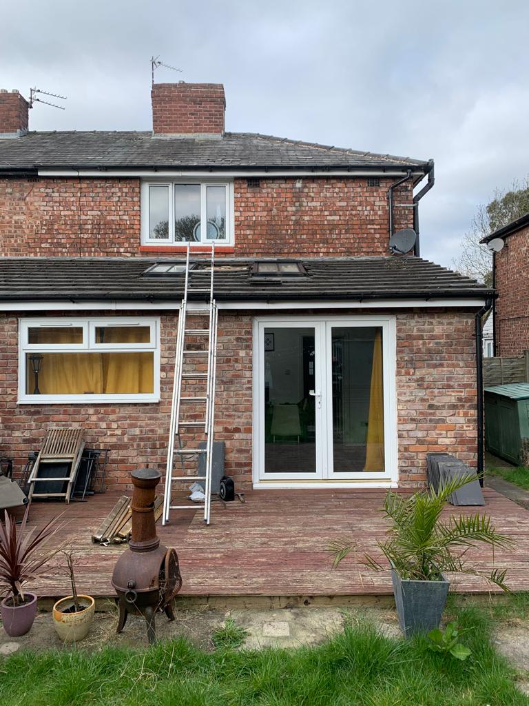 A picture of the rear elevation of a proeprty undergoing a replacement of the extension roof