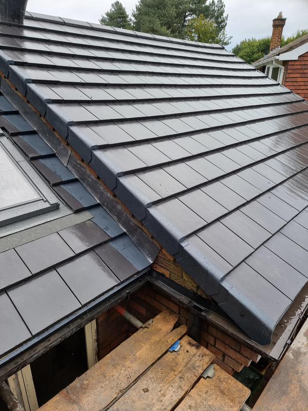 A pciture of a gable roof replacement by Roofers Manchester