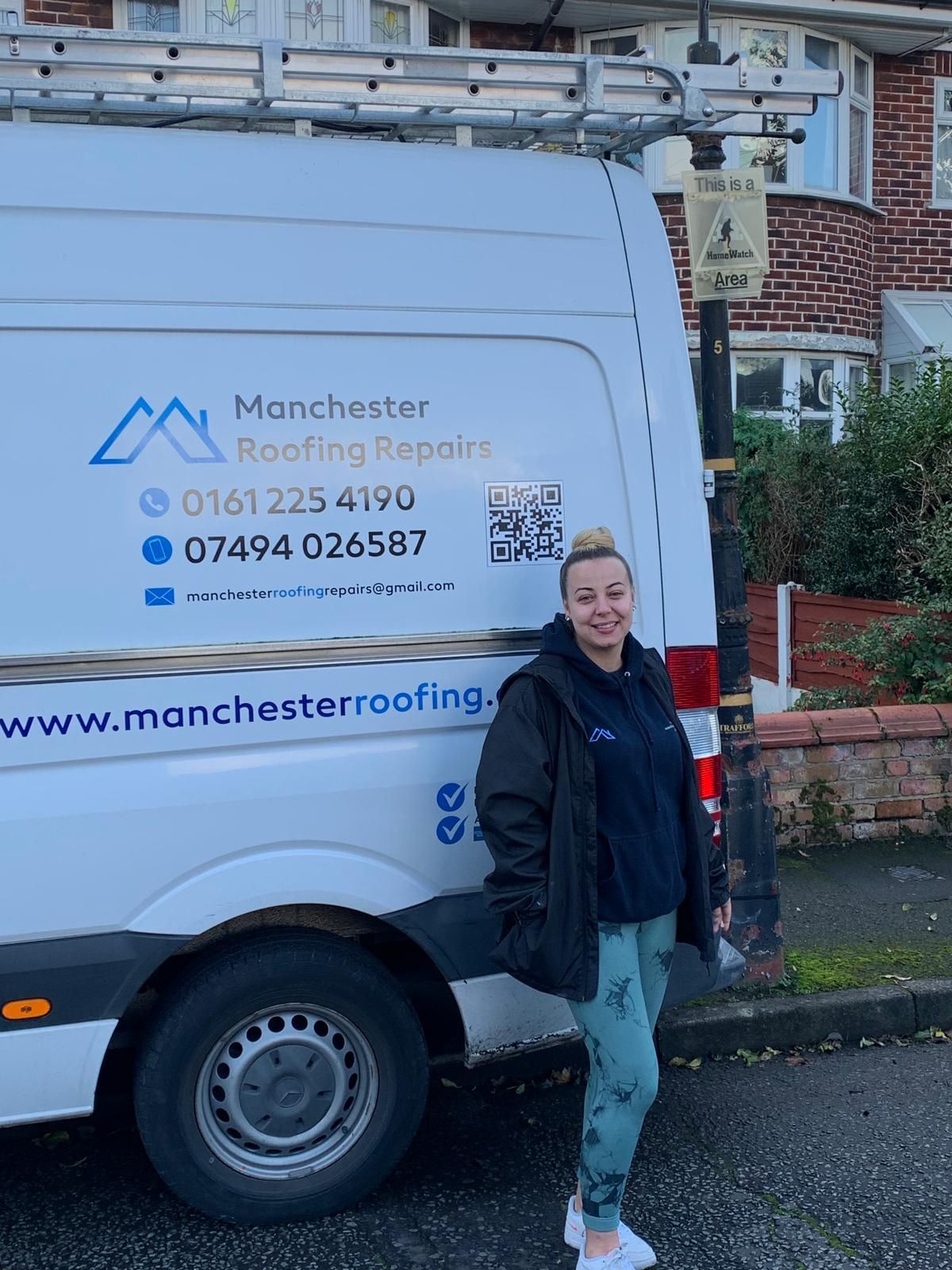 A picture of a female staff member standing in front of the Manchester Roofing Repairs work van.