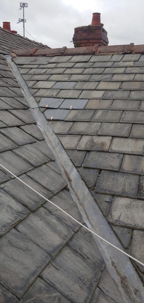 A picture of a lead valley repaired by Roofers Manchester