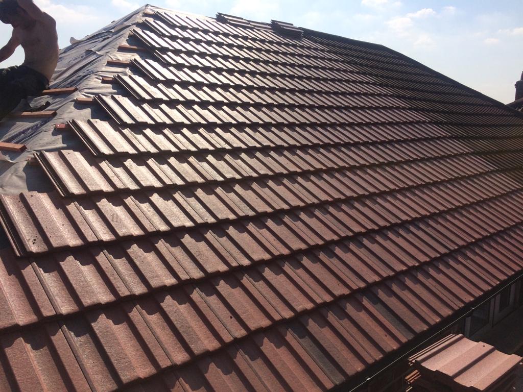 Picture of a new hipped roof carried out by Roofers Manchester