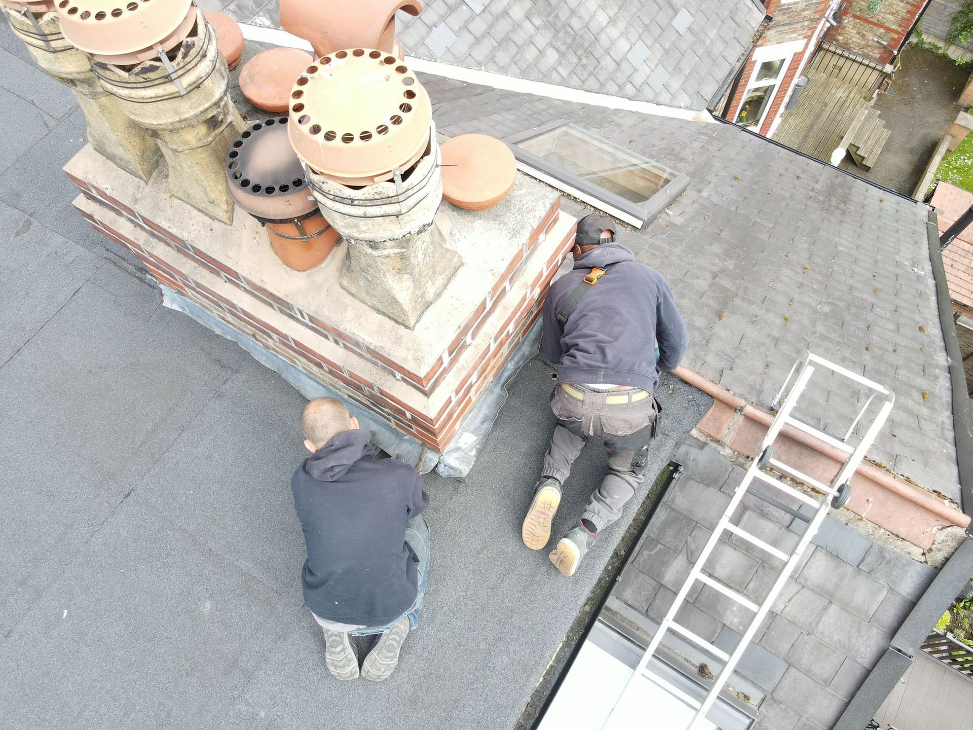 A picture of Manchester Roofers repairing a flat roof