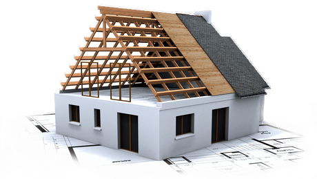 House under construction, wooden roof frame, partially shingled, on blueprint.