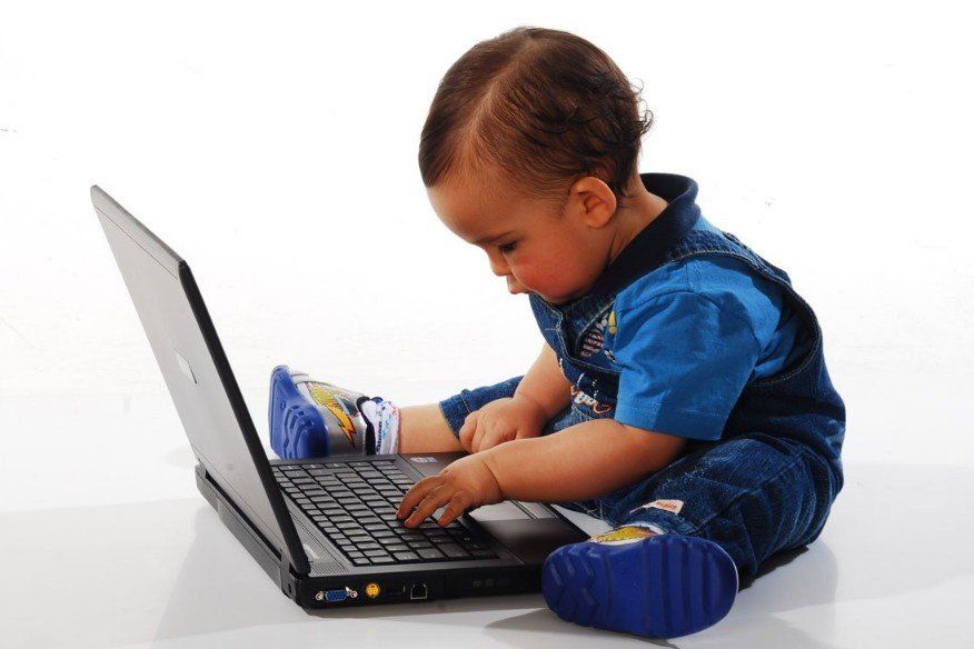 toddler with computer