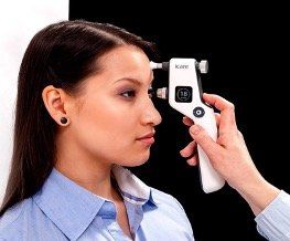 Woman getting intraocular pressure measured with i-Care tonometer