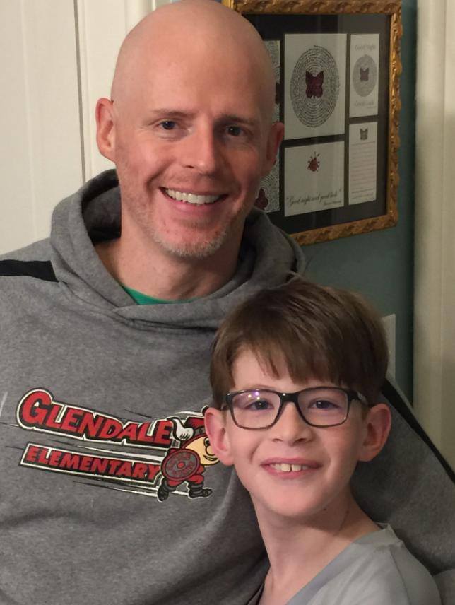 Dr. Lyons with his son wearing glasses prior to orthokeratology treatment