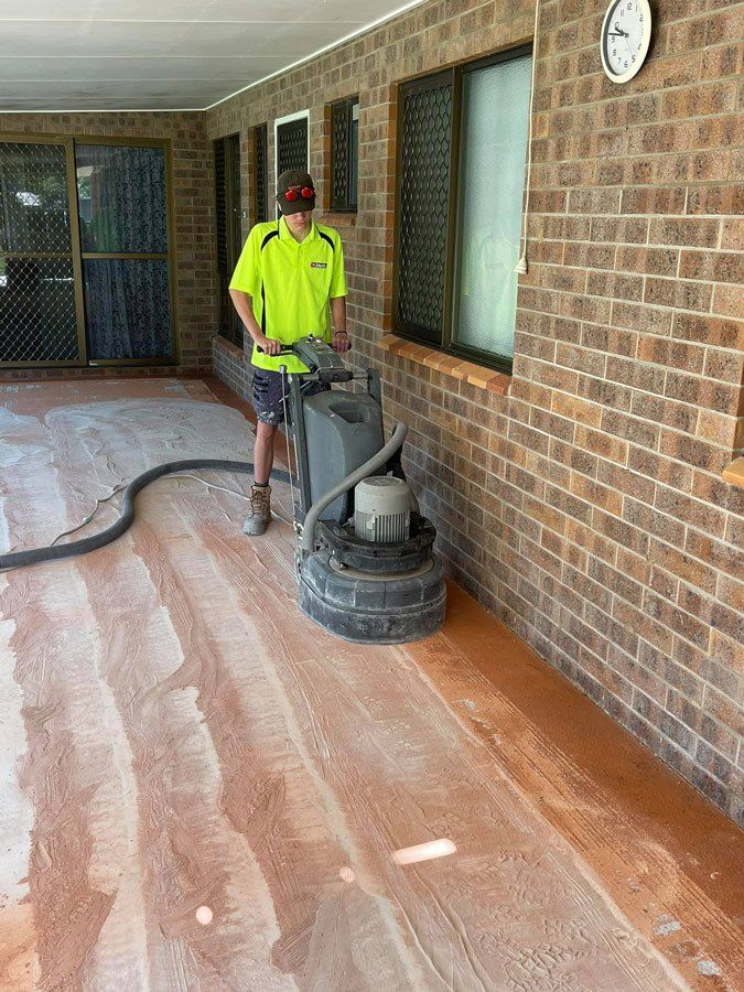Worker Using Floor Polisher Machine — Epoxy Floor Coating in Whitsundays, QLD