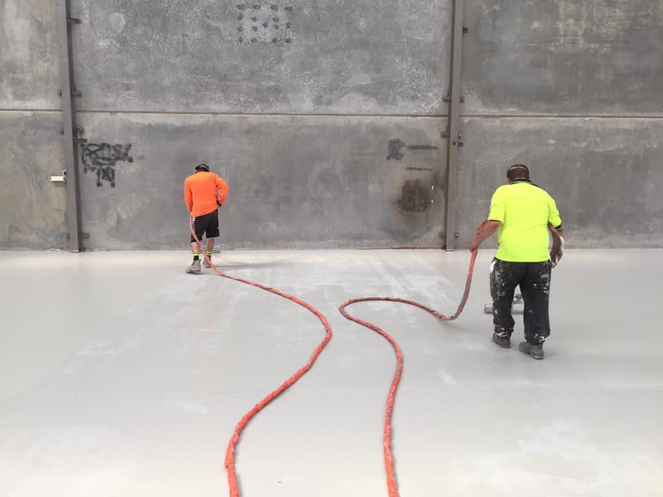 Two Workers Cleaning Floors — Epoxy Floor Coating in Moranbah, QLD