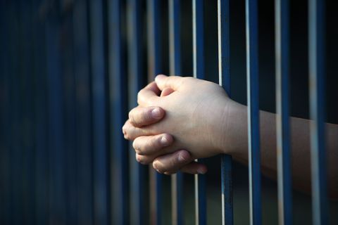 Criminal Case Lawyer — Prisoner Hand in Jail in San Antonio, TX