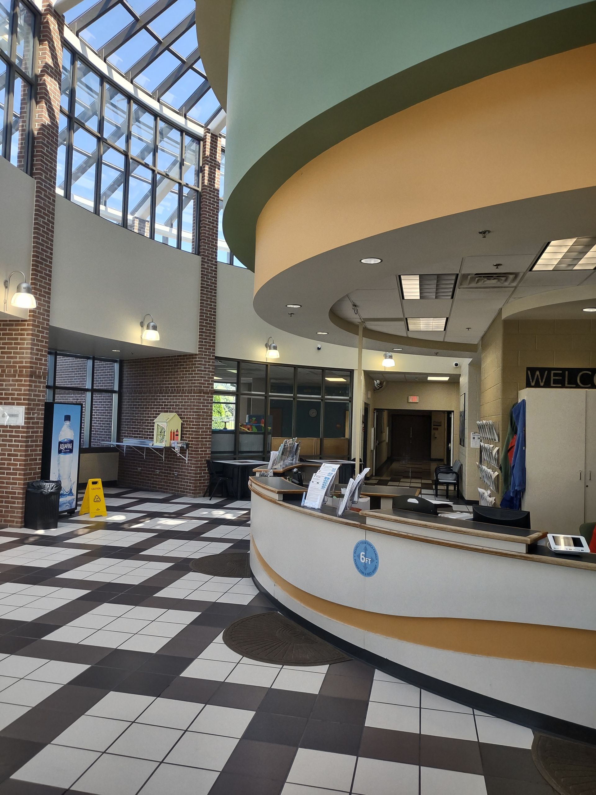 The inside of a building with a circular reception desk
