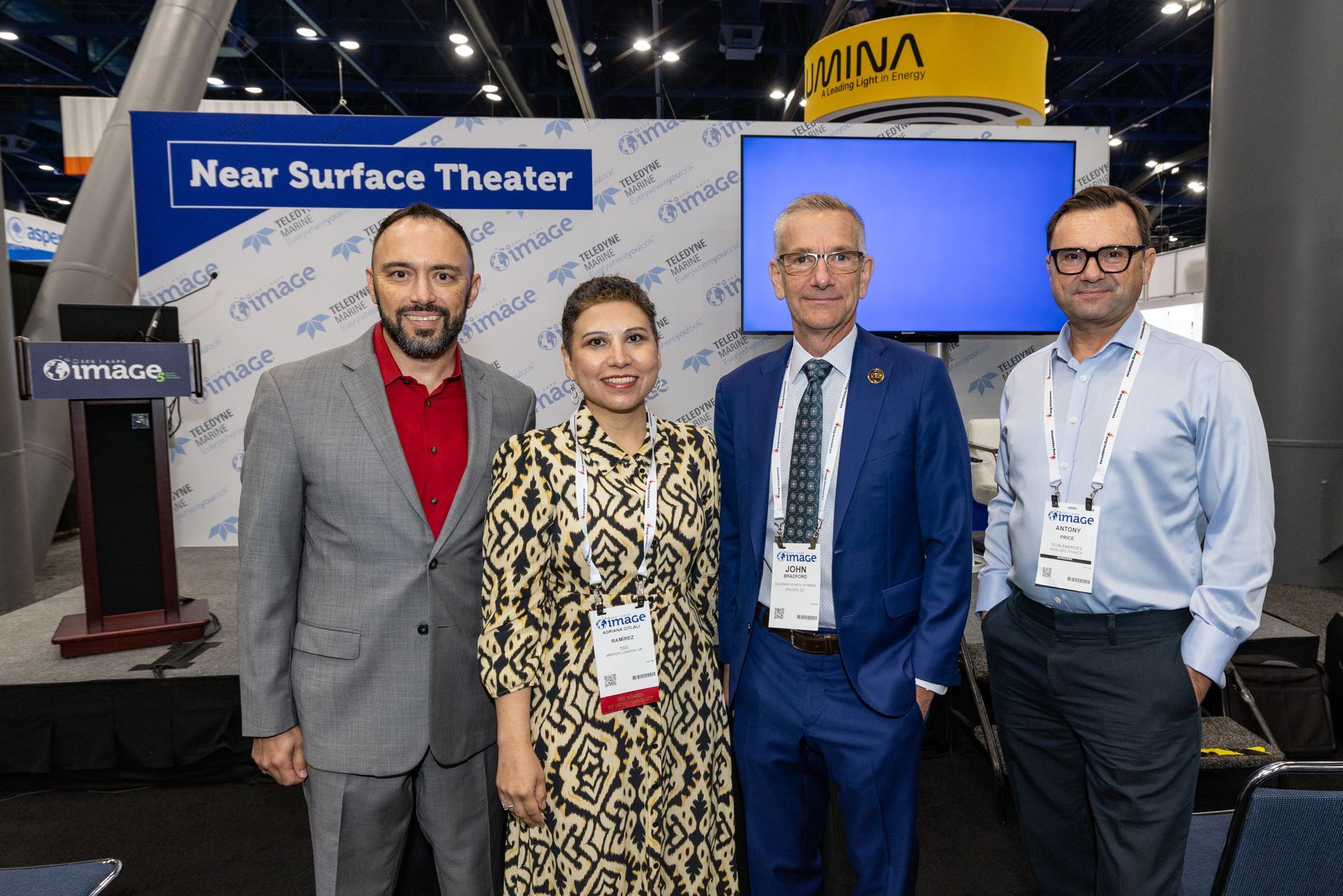 Four people standing near a