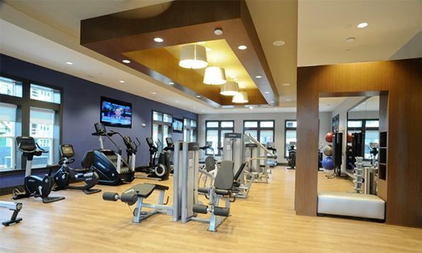 A large gym with a lot of exercise equipment