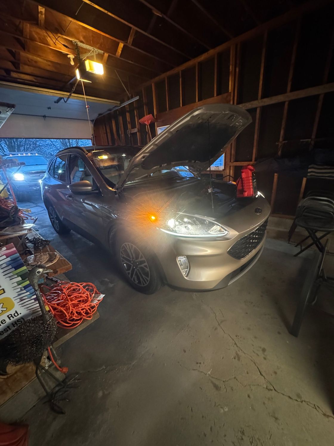 jump starting the dead battery in the garage