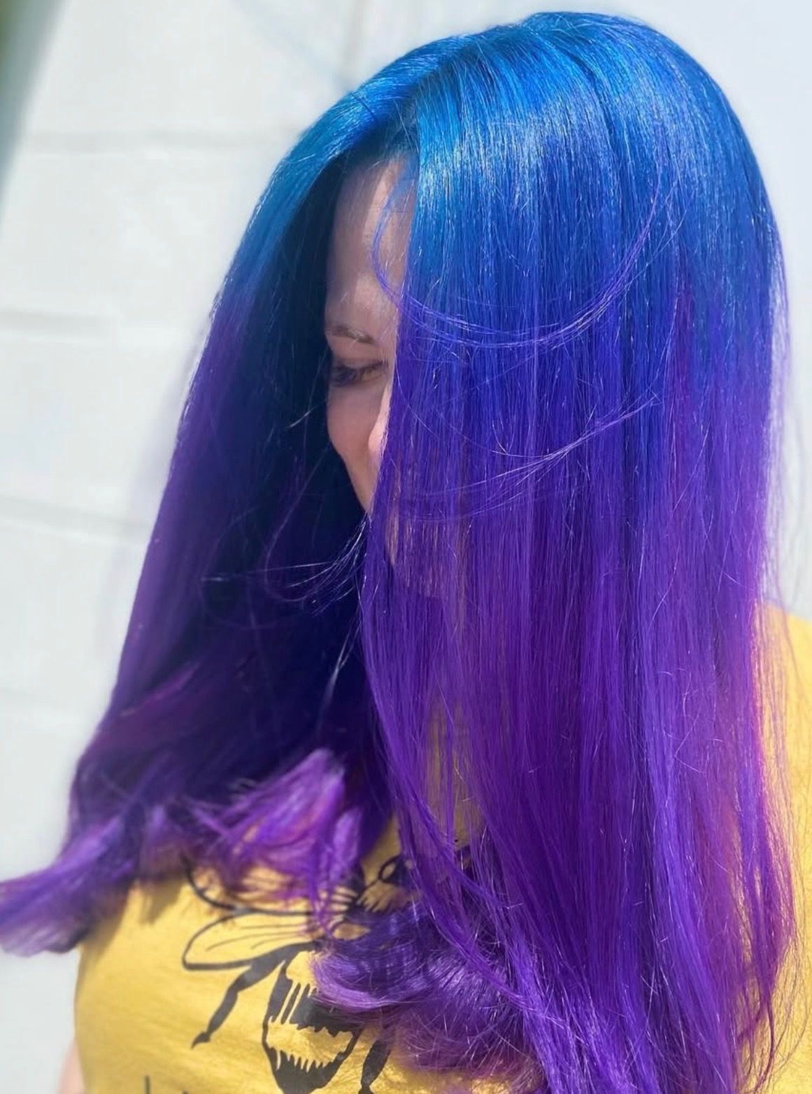 Blue, purple, and green hair with wavy texture.